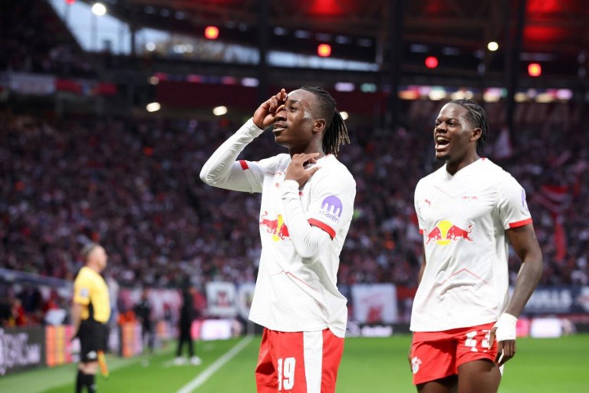 Leipzig's Ivorian forward #49 Yan Diomande (L) and Leipzig's French defender #23 Castello Lukeba celebrate the team's first goal after Stuttgart's German defender #24 Jeff Chabot scored an own goal during the German first division Bundesliga football match between RB Leipzig and VfB Stuttgart in Leipzig, eastern Germany on November 1, 2025. Ronny HARTMANN / AFP