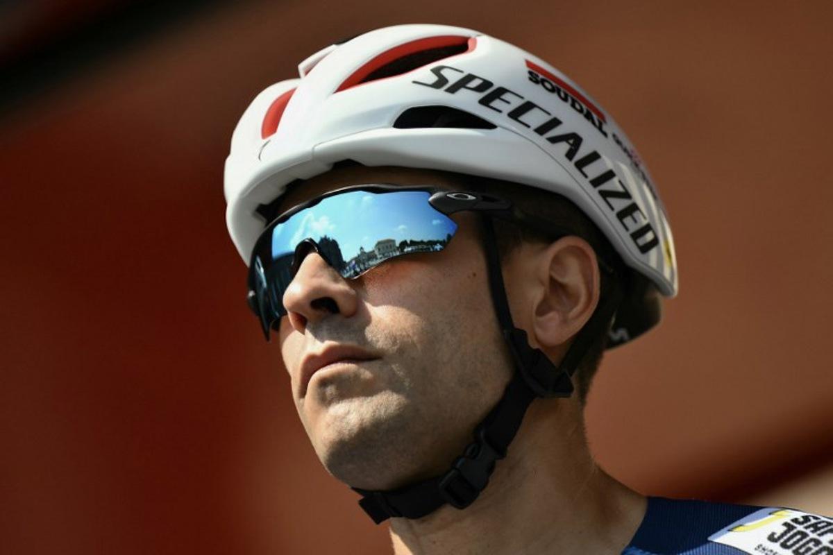 Soudal Quick-Step's Spanish rider Mikel Landa is presented on stage before the start of the Vuelta a Espana, a 183 km race between Torino - Reggia di Venaria and Novara, in Italy's Piemonte region, on August 23, 2025. Marco BERTORELLO / AFP