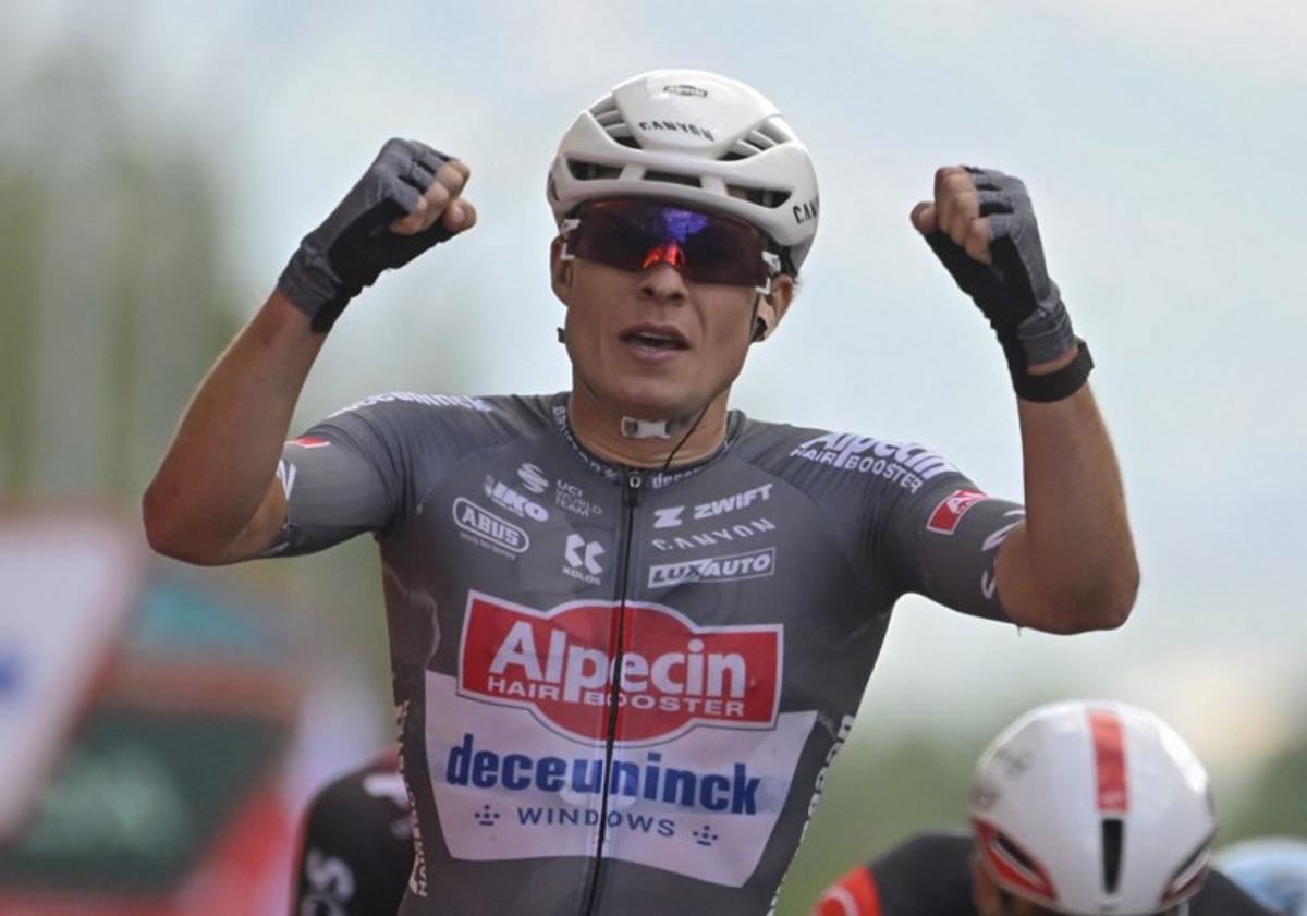 Stage winner team Alpecin's Belgian rider Jasper Philipsen celebrates crossing first the finish line of the 19th stage of the Vuelta a Espana, a 159 km race between Rueda and Guijuelo, on September 12, 2025. Miguel RIOPA / AFP