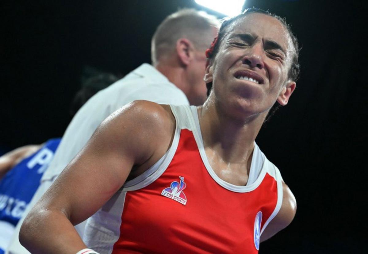 France's Wassila Lkhadiri reacts at the end of the match against Philippines' Aira Villegas in the women's 50kg quarter-final boxing match during the Paris 2024 Olympic Games at the North Paris Arena, in Villepinte on August 3, 2024. MOHD RASFAN / AFP