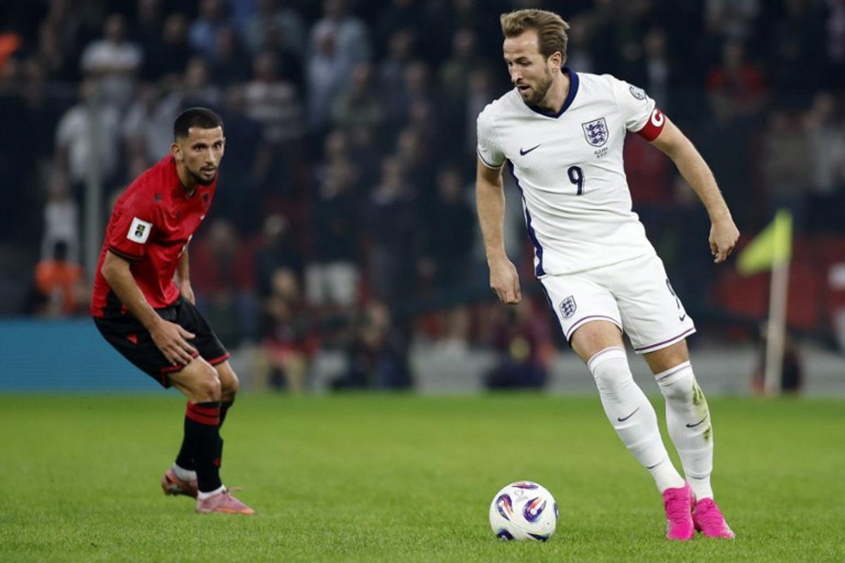 England's striker #09 Harry Kane controls the ball in front of Albania's defender #17 Naser Aliji during the FIFA World Cup 2026 European qualification football match between Albania and England at the Air Albania stadium in Tirana, on November 16, 2025. Adnan Beci / AFP