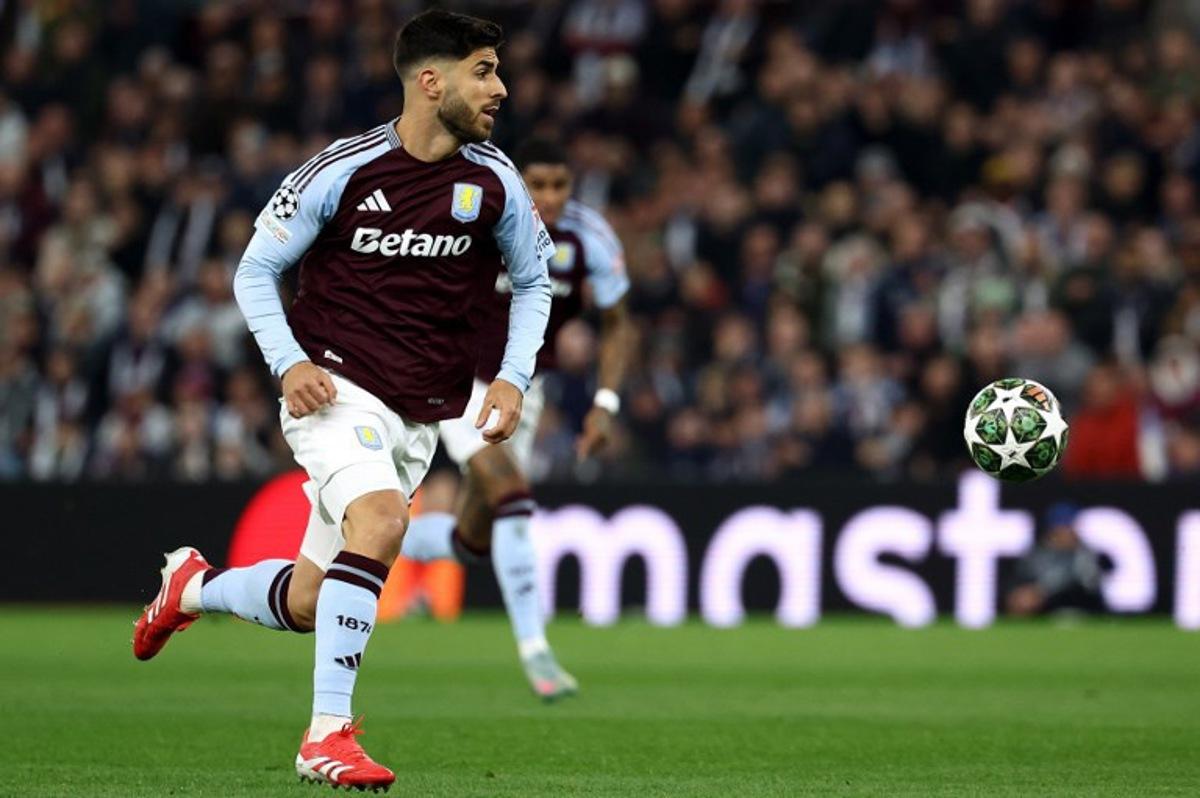 Aston Villa's Spanish midfielder #21 Marco Asensio controls the ball during the UEFA Champions League quarter-final second-leg football match between Aston Villa and Paris Saint-Germain at Villa Park in Birmingham, central England on April 15, 2025. FRANCK FIFE / AFP