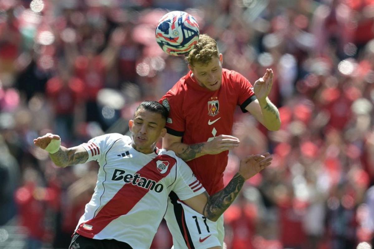 River Plate's Colombian midfielder #22 Kevin Castano and Urawa Red Diamonds' Swedish midfielder #11 Samuel Gustafson fight for the ball during the FIFA Club World Cup 2025 Group E football match between Argentina's River Plate and Japan's Urawa Red Diamonds at the Lumen Field stadium in Seattle on June 17, 2025. JUAN MABROMATA / AFP