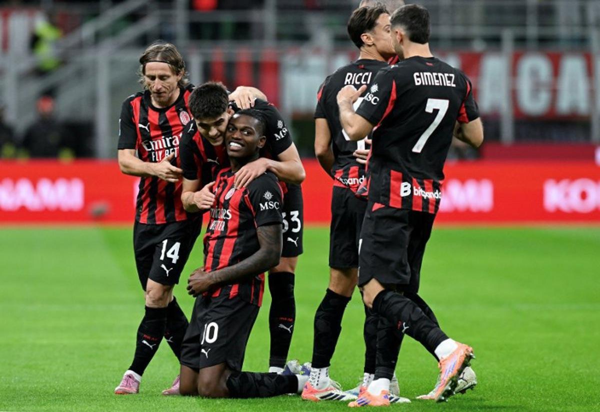 AC Milan's Portuguese forward #10 Rafael Leao (3rd L) celebrates with his teammates after scoring his team's opening goal during the Italian Serie A football match between AC Milan and Pisa SC at San Siro stadium in Milan, northern Italy, on October 24, 2025. Stefano RELLANDINI / AFP