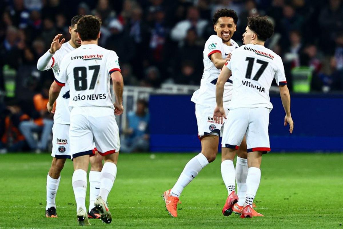 Paris Saint-Germain's Brazilian defender #05 Marquinhos (2nd R) celebrates with teammates after scoring his team's second goal during the French Cup (Coupe de France) semi-final football match between USL Dunkirk and Paris Saint-Germain (PSG) at the Pierre-Mauroy stadium in Villeneuve-d'Ascq, northern France, on April 1, 2025. Sameer Al-Doumy / AFP