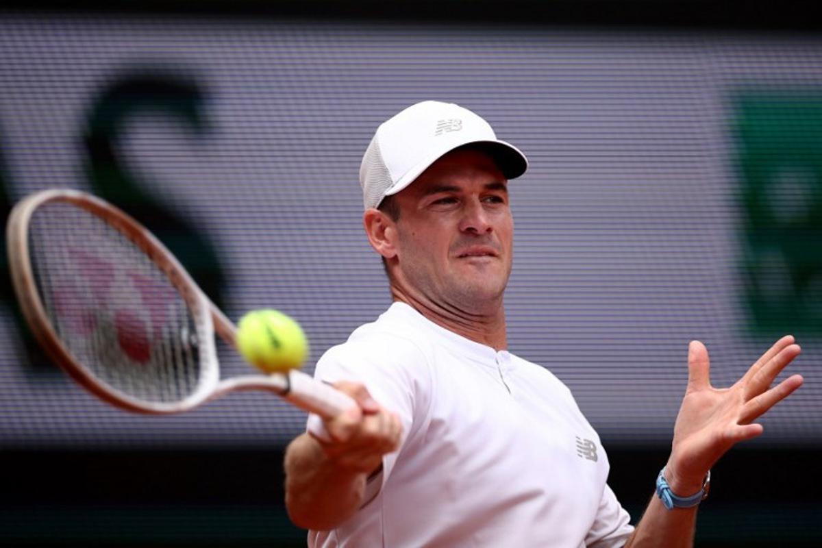 US Tommy Paul plays a forehand return to Australia's Alexei Popyrin during their men's singles match on day 8 of the French Open tennis tournament on Court Suzanne-Lenglen at the Roland-Garros Complex in Paris on June 1, 2025. Anne-Christine POUJOULAT / AFP