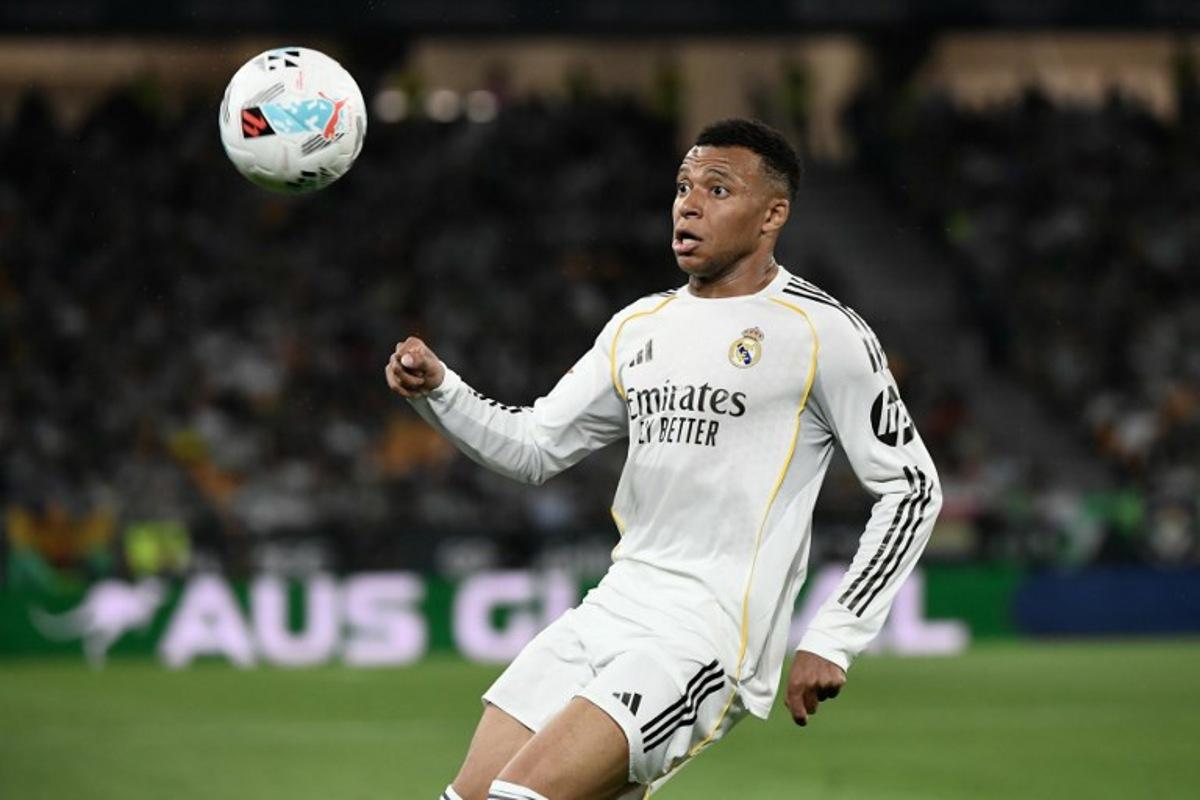 Real Madrid's French forward #10 Kylian Mbappe controls the ball during the Spanish league football match between Real Betis and Real Madrid CF at the La Cartuja stadium in Seville on April 24 , 2026. CRISTINA QUICLER / AFP