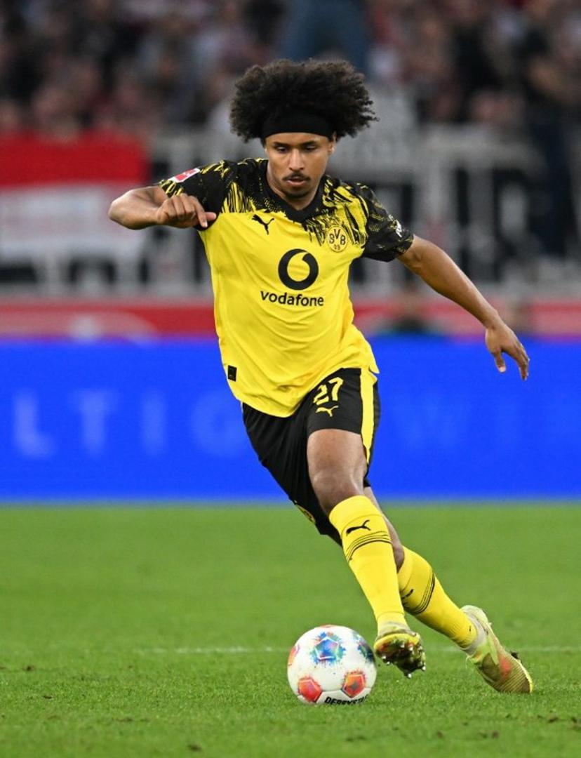 Dortmund's German forward #27 Karim Adeyemi plays the ball during the German first division Bundesliga football match between VfB Stuttgart and BVB Borussia Dortmund in Stuttgart, southern Germany, on April 4, 2026. THOMAS KIENZLE / AFP