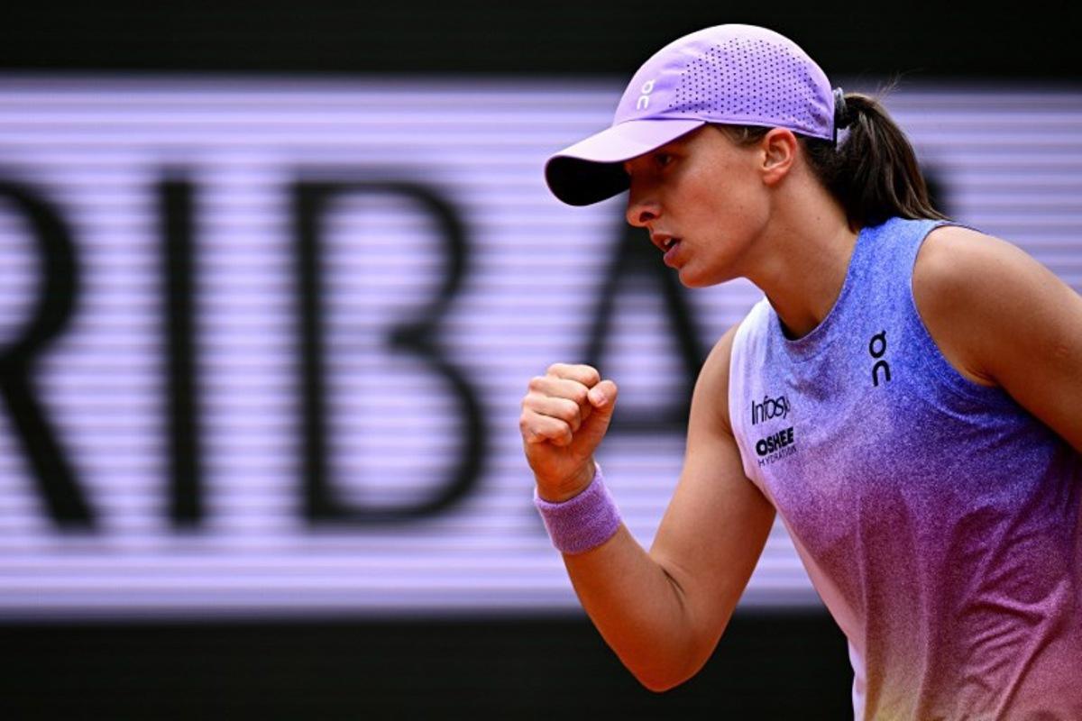 Poland's Iga Swiatek reacts to a point against Kazakhstan's Elena Rybakina during their women's singles match on day 8 of the French Open tennis tournament on Court Philippe-Chatrier at the Roland-Garros Complex in Paris on June 1, 2025. JULIEN DE ROSA / AFP