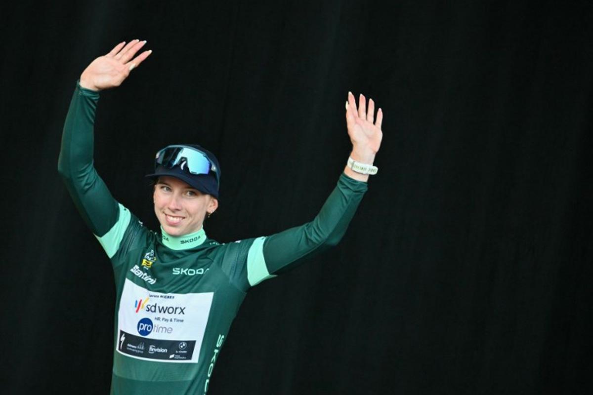 Team SD Worx-Protime's Dutch rider Lorena Wiebes celebrates on the podium wearing the best sprinter's green jersey after the 9th and final stage of the fifth edition of the Women's Tour de France cycling race, 99.2 km from Nice to Nice, southeastern France on August 9, 2026. NICOLAS TUCAT / AFP