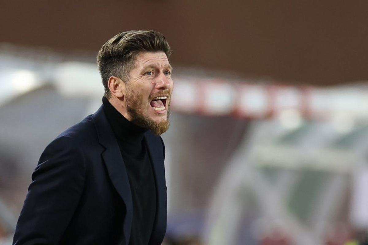 Monaco's Belgian head coach Sebastien Pocognoli gives instructions to his players during the French L1 football match between AS Monaco and Paris Saint-Germain (PSG) at the Stade Louis II in the Principality of Monaco on November 29, 2025. Valery HACHE / AFP