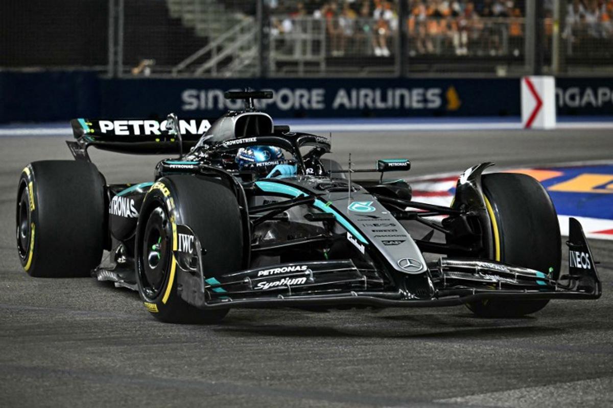 Mercedes' British driver George Russell drives during the Formula One Singapore Grand Prix night race at the Marina Bay Street Circuit in Singapore on October 5, 2025. MOHD RASFAN / AFP