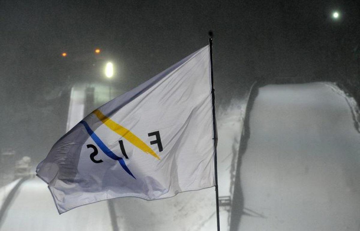 This picture taken on December 2010 at the Harrachov's ski jump hill shows a flag of International Ski Federation (FIS) blowing in the wind as the FIS Ski Jumping World Cup has been delayed due to a strong wind. AFP PHOTO/MICHAL CIZEK Michal CIZEK / AFP