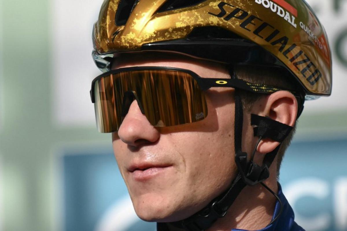 Soudal Quick-Step team's Belgian rider Remco Evenepoel looks on from the presentation podium before the start of 118th edition of the Giro di Lombardia (Tour of Lombardy), a 252km cycling race from Bergamo to Como on October 12, 2024. Marco BERTORELLO / AFP