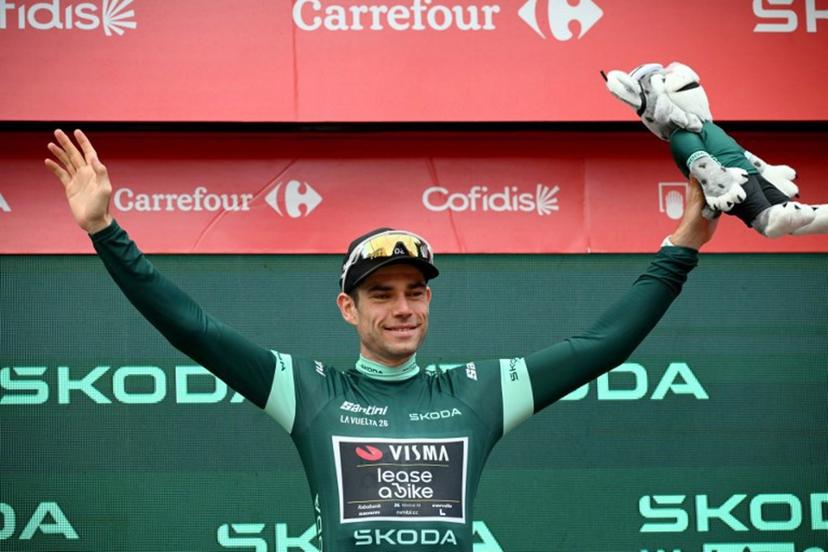 Team Visma-Lease a bike's Belgian rider Wout van Aert celebrates on the podium wearing the points ranking leader's green jersey after the 11th stage of the Vuelta a Espana 2026 cycling tour, a 151,3 km race between Carthagena and Lorca, on September 2, 2026. JOSE JORDAN / AFP