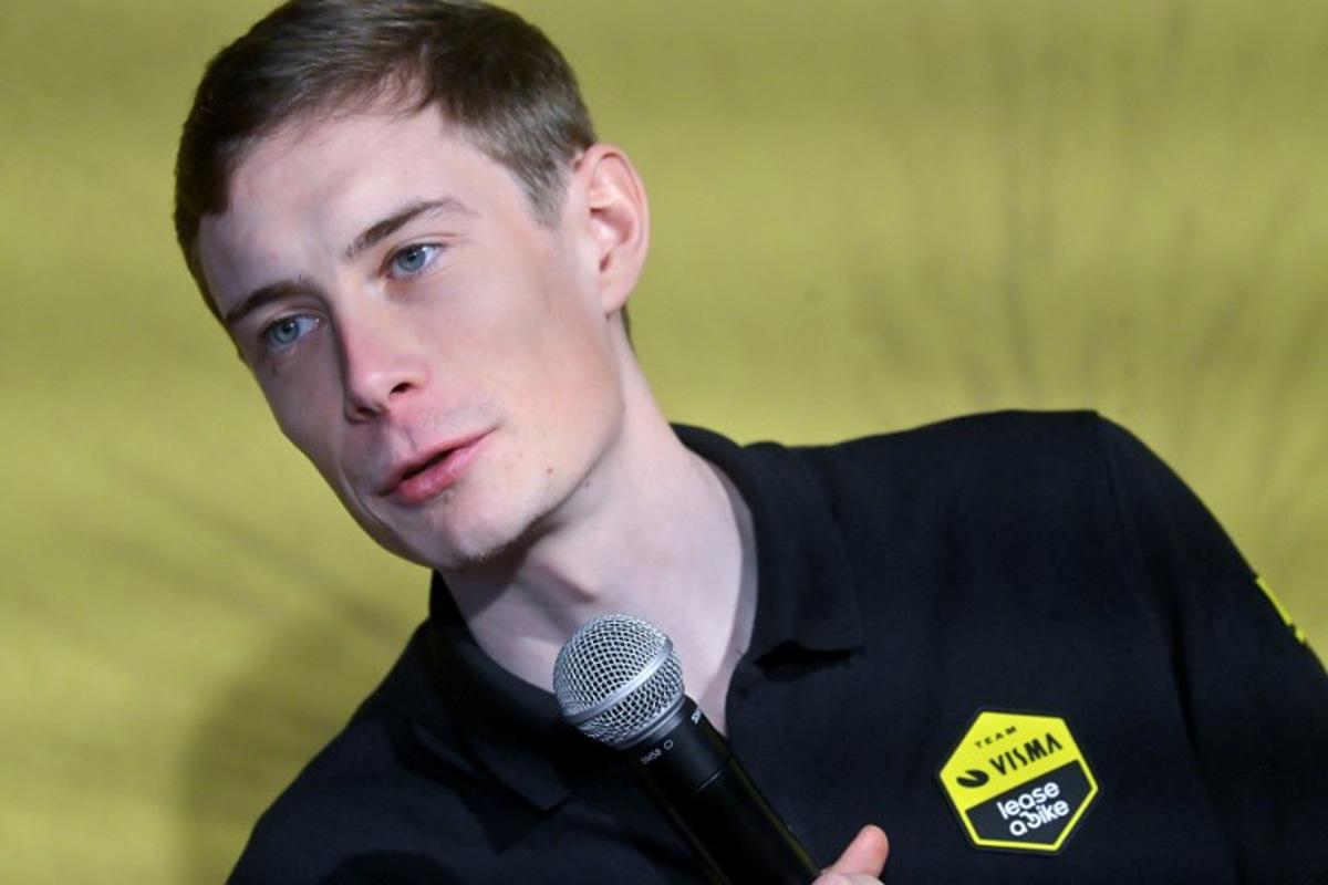 Visma-Lease a bike's Danish rider Jonas Vingegaard speaks at a press conference during the presentation of the Visma-Lease a Bike cycling team at La Nucia near Alicante, eastern Spain on January 13, 2026. Jose Jordan / AFP