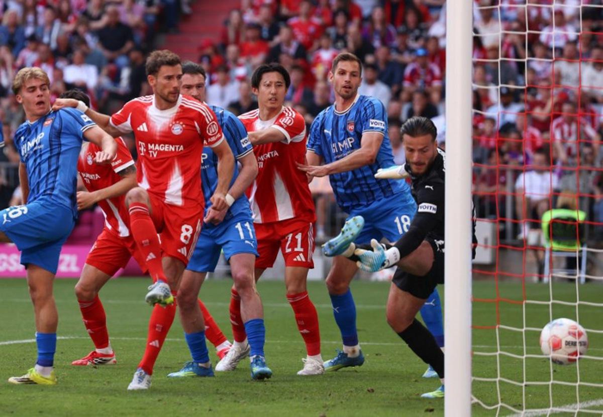 Bayern Munich's German midfielder #08 Leon Goretzka (2L) scores his team's second goal during the German first division Bundesliga football match between FC Bayern Munich and Heidenheim in Munich on May 2, 2026. Alexandra BEIER / AFP