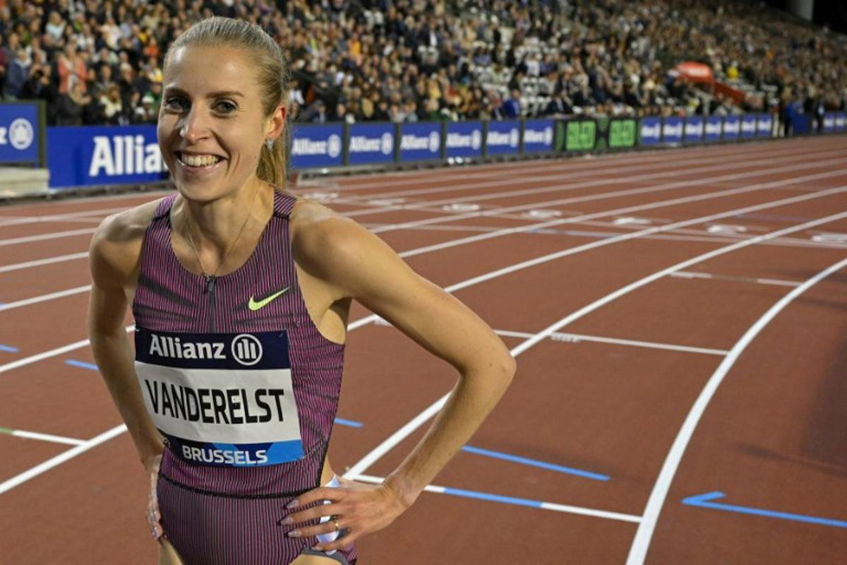 Belgium's Elise Vanderelst celebrates after breaking the Belgian record in the Women's 1500m final of the Memorial Van Damme Diamond League athletics finals at the Roi Baudouin Stadium in Brussels on September 14, 2024. NICOLAS TUCAT / AFP