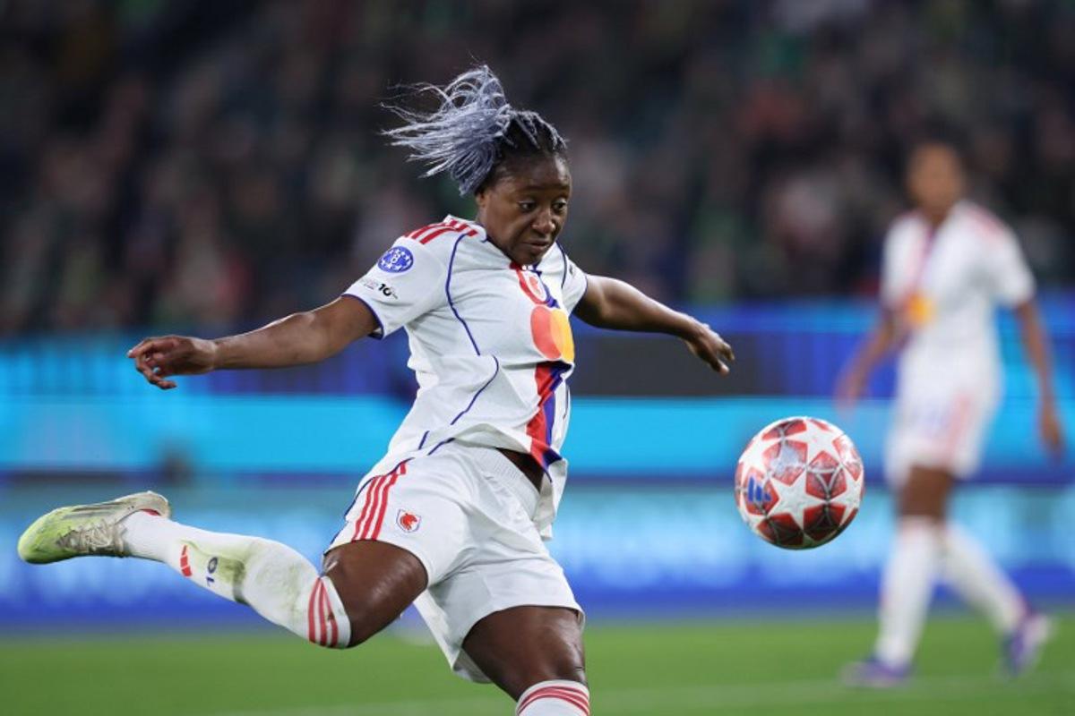Lyon's French forward #11 Kadidiatou Diani kicks the ball during the UEFA Women's Champions League Quarter final First Leg football match VfL Wolfsburg v Olympique Lyonnais (OL) in Wolfsburg, northern Germany, on March 24, 2026. Ronny HARTMANN / AFP