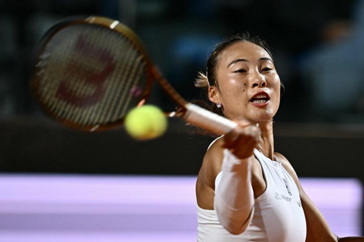 China's Zheng Qinwen returns to USA's Coco Gauff during her women's singles semi-final match for the WTA Rome Open tennis tournament at Foro Italico in Rome on May 15, 2025. Filippo MONTEFORTE / AFP