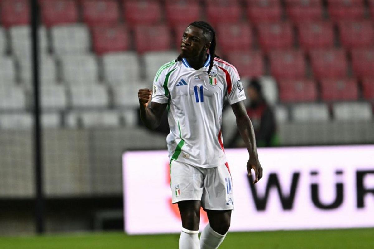 Italy's forward #11 Moise Kean celebrates after scoring the equalizing 1-1 goal during the 2026 World Cup qualifiers Europe zone group I football match between Israel and Italy on September 8, 2025 in Debrecen, Hungary. Attila KISBENEDEK / AFP