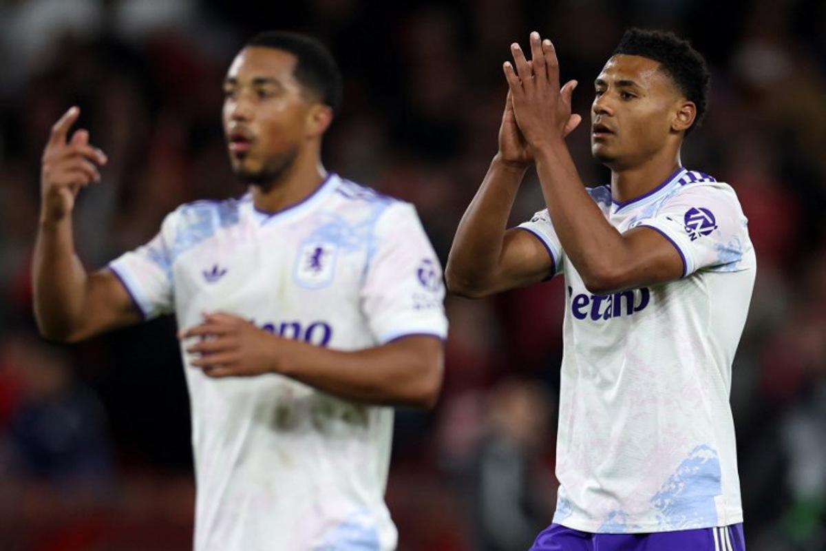 Aston Villa's Belgian midfielder #08 Youri Tielemans (L) and Aston Villa's English striker #11 Ollie Watkins applauds the fans following the UEFA Europa League semi-final first-leg football match between Nottingham Forest and Aston Villa at The City Ground in Nottingham, central England, on April 30, 2026. Darren Staples / AFP