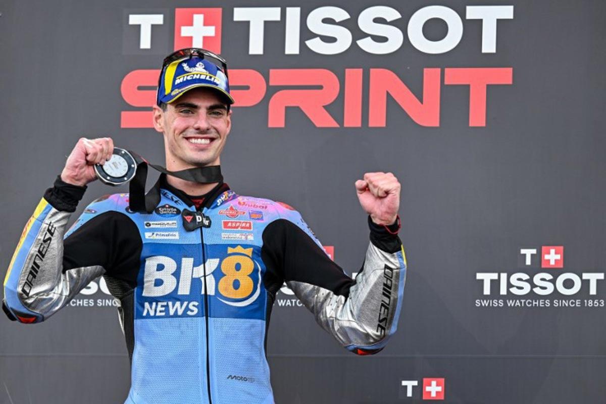 Second-placed BK8 Gresini Racing MotoGP team's Spanish MotoGP rider Fermin Aldeguer celebrates on the podium after the Sprint Race at the MotoGP Indonesian Grand Prix at the Mandalika International Circuit in Mandalika, West Nusa Tenggara on October 4, 2025. SONNY TUMBELAKA / AFP