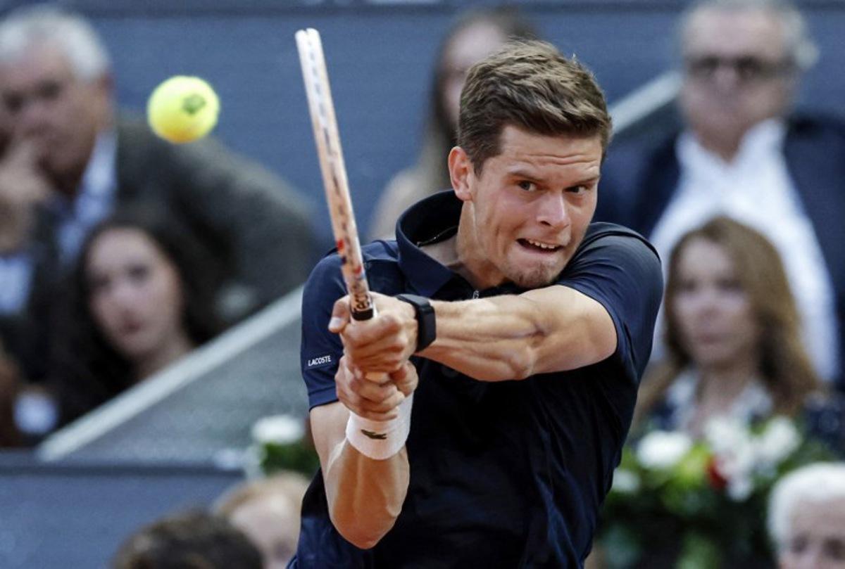 Belgium's Alexander Blockx returns the ball to Germany's Alexander Zverev during their 2026 ATP Tour Madrid Open tennis tournament semi-final singles match at the Caja Magica in Madrid, on May 1, 2026. OSCAR DEL POZO / AFP