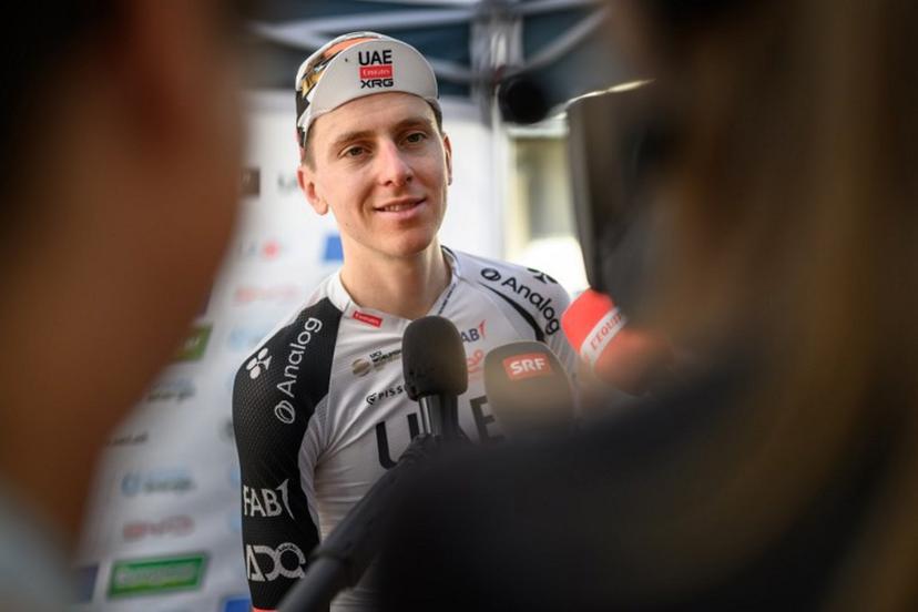 UAE Team Emirates-XRG's Slovenian rider Tadej Pogacar answers questions from jounalists after winning the fourth stage, a 23,7 km time trial from Aarburg to Aarburg, at the Men's Tour of Switzerland (Tour de Suisse) cycling race in Aarburg, Switzerland, on June 20, 2026. Fabrice COFFRINI / AFP