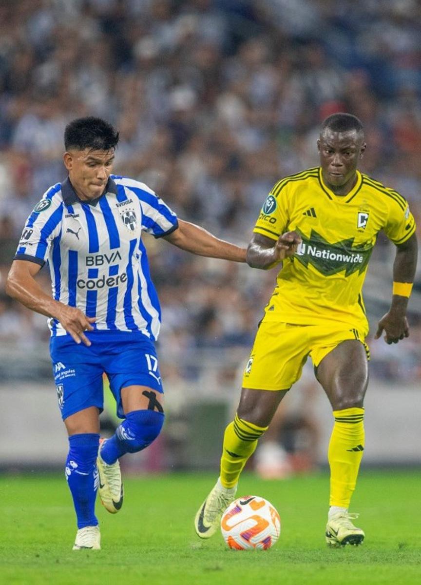 Monterrey's Jesus Gallardo (L) fights for the ball with Columbus Crew's Yaw Yeboah during the Concacaf Champions Cup semi-final second leg football match between Mexico's Monterrey and USA's Columbus Crew at the BBVA Bancomer stadium in Monterrey, Mexico on May 1, 2024. Julio Cesar AGUILAR / AFP