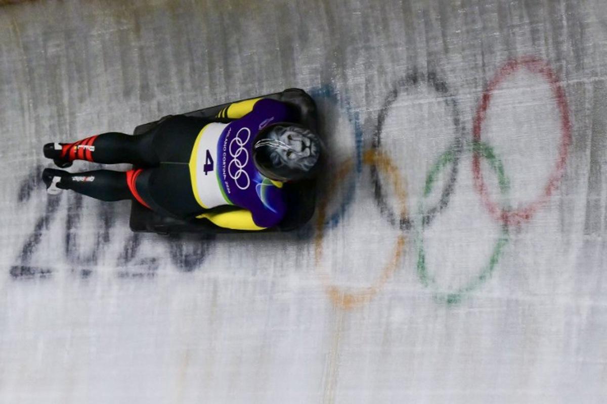 Belgium's Kim Meylemans competes in the skeleton women's heat 2 at Cortina Sliding Centre during the Milano Cortina 2026 Winter Olympic Games in Cortina d'Ampezzo on February 13, 2026. Stefano RELLANDINI / AFP