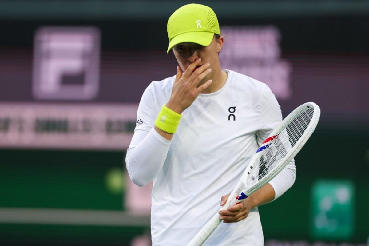 Poland's Iga Swiatek reacts while playing against Russia's Mirra Andreeva during their women's singles semi-final tennis match at the BNP Paribas Open at the Indian Wells Tennis Garden in Indian Wells, California, on March 14, 2025. Patrick T. Fallon / AFP