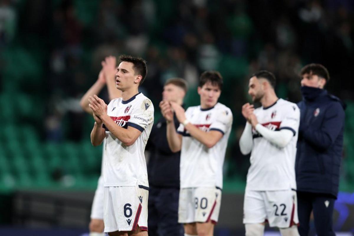 Bologna's Croatian midfielder #06 Nikola Moro and teammates react at the end of the league phase football match between Sporting CP and Bologna FC at Alvalade stadium in Lisbon on January 29, 2025. Filipe AMORIM / AFP