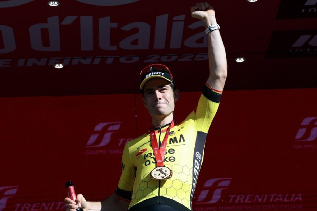 Team Visma-Lease a Bike's Belgian rider Wout Van Aert celebrates on the podium after winning the 9th stage of the 108th Giro d'Italia cycling race of 181kms from Gubbio to Siena on May 18, 2025. Luca Bettini / AFP