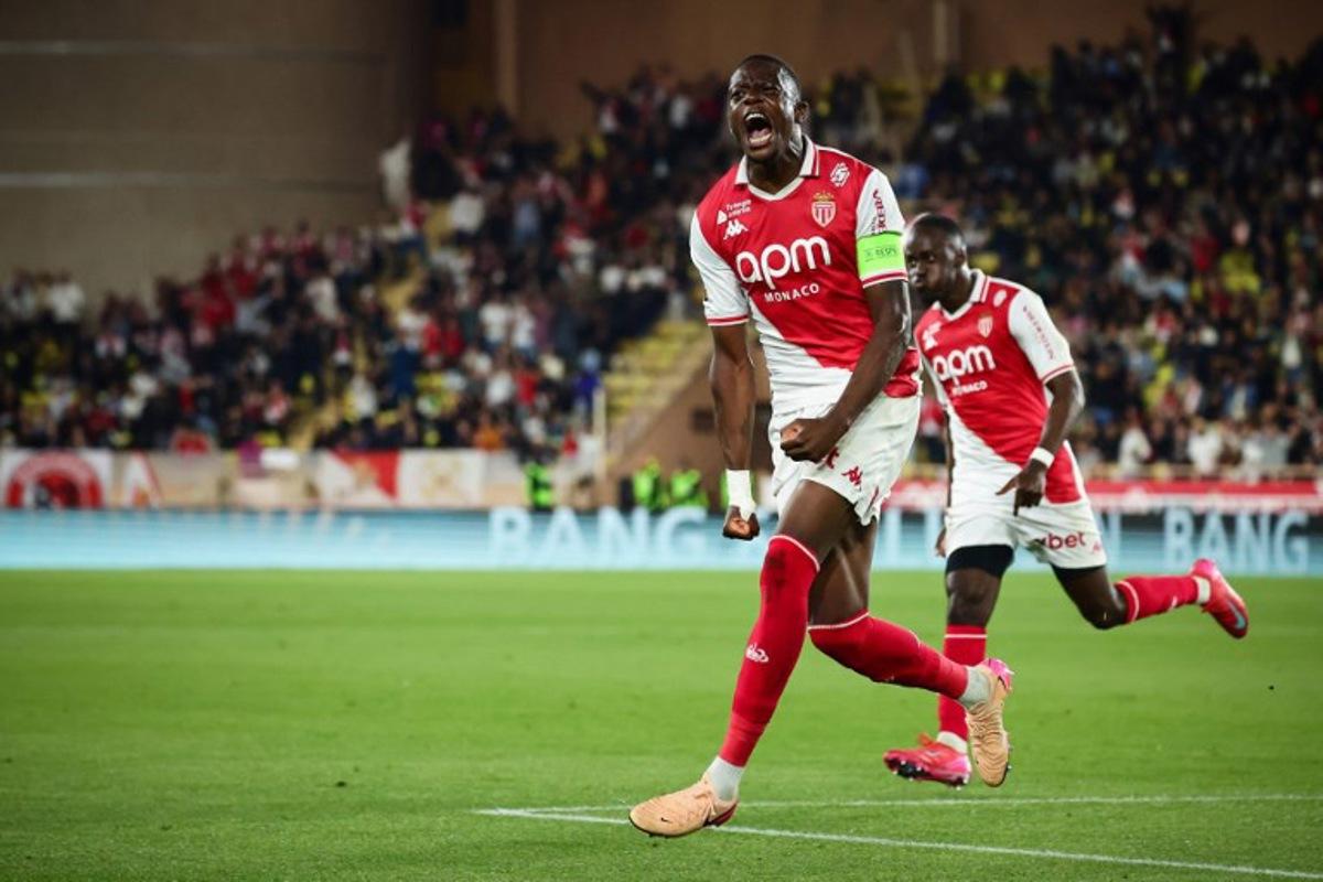 Monaco's Swiss midfielder #06 Denis Zakaria celebrates after scoring his team's second goal during the French L1 football match between AS Monaco and Olympique Lyonnais (OL) at the Louis II Stadium (Stade Louis II) in the Principality of Monaco on May 10, 2025. CLEMENT MAHOUDEAU / AFP