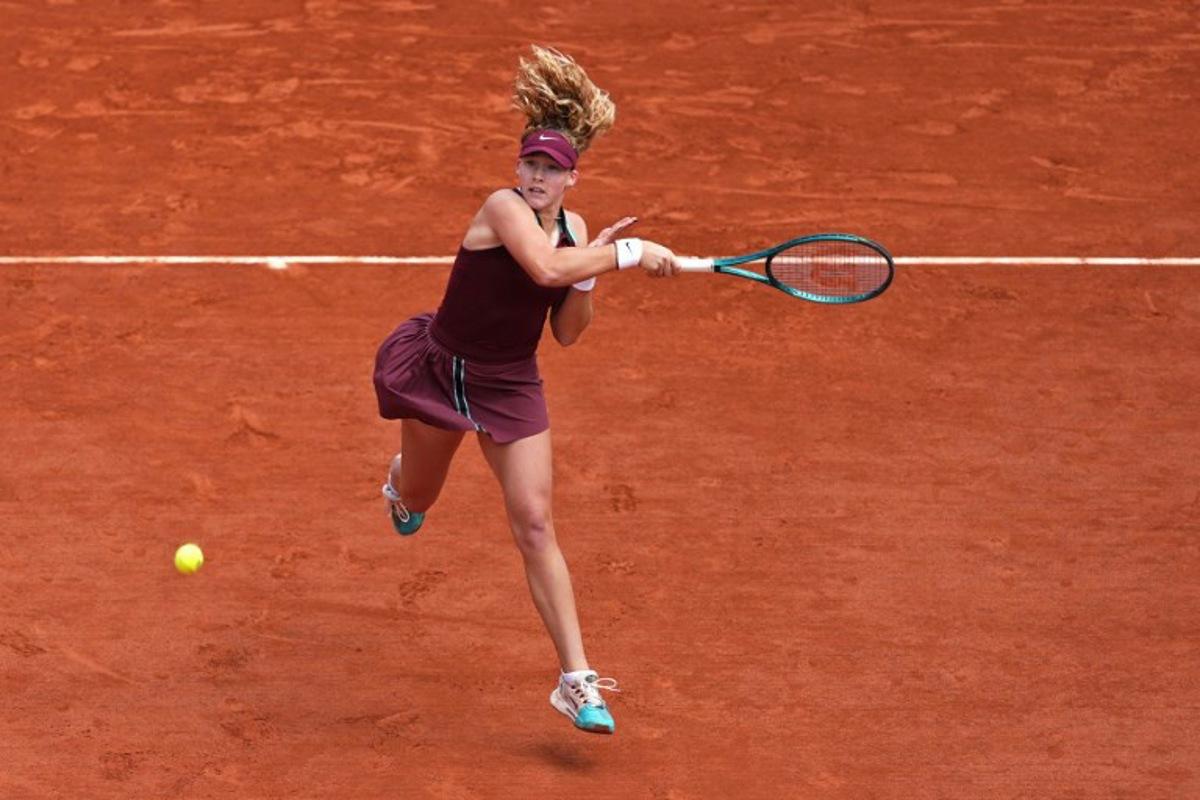 Russia's Mirra Andreeva plays a forehand return to Australia's Daria Kasatkina during their women's singles match on day 9 of the French Open tennis tournament on Court Suzanne-Lenglen at the Roland-Garros Complex in Paris on June 2, 2025. Dimitar DILKOFF / AFP