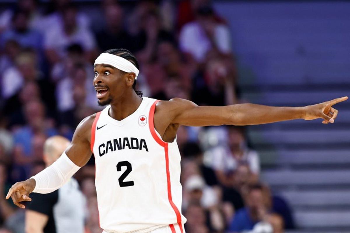 Canada's #02 Shai Gilgeous-Alexander reacts in the men's preliminary round group A basketball match between Canada and Australia during the Paris 2024 Olympic Games at the Pierre-Mauroy stadium in Villeneuve-d'Ascq, northern France, on July 30, 2024. Sameer Al-Doumy / AFP