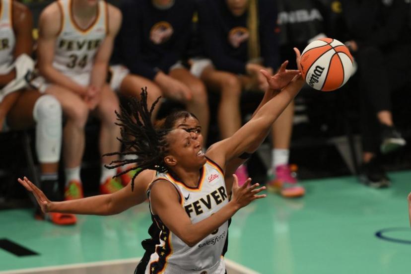 (L-R) New York Liberty #8 Nyara Sabally attempts to block a shot by Indiana Fever #0 Kelsey Mitchell during a WNBA game between the Fever and Liberty, at the Barclays Center in Brooklyn on May 18, 2024, in New York City. ANGELA WEISS / AFP
