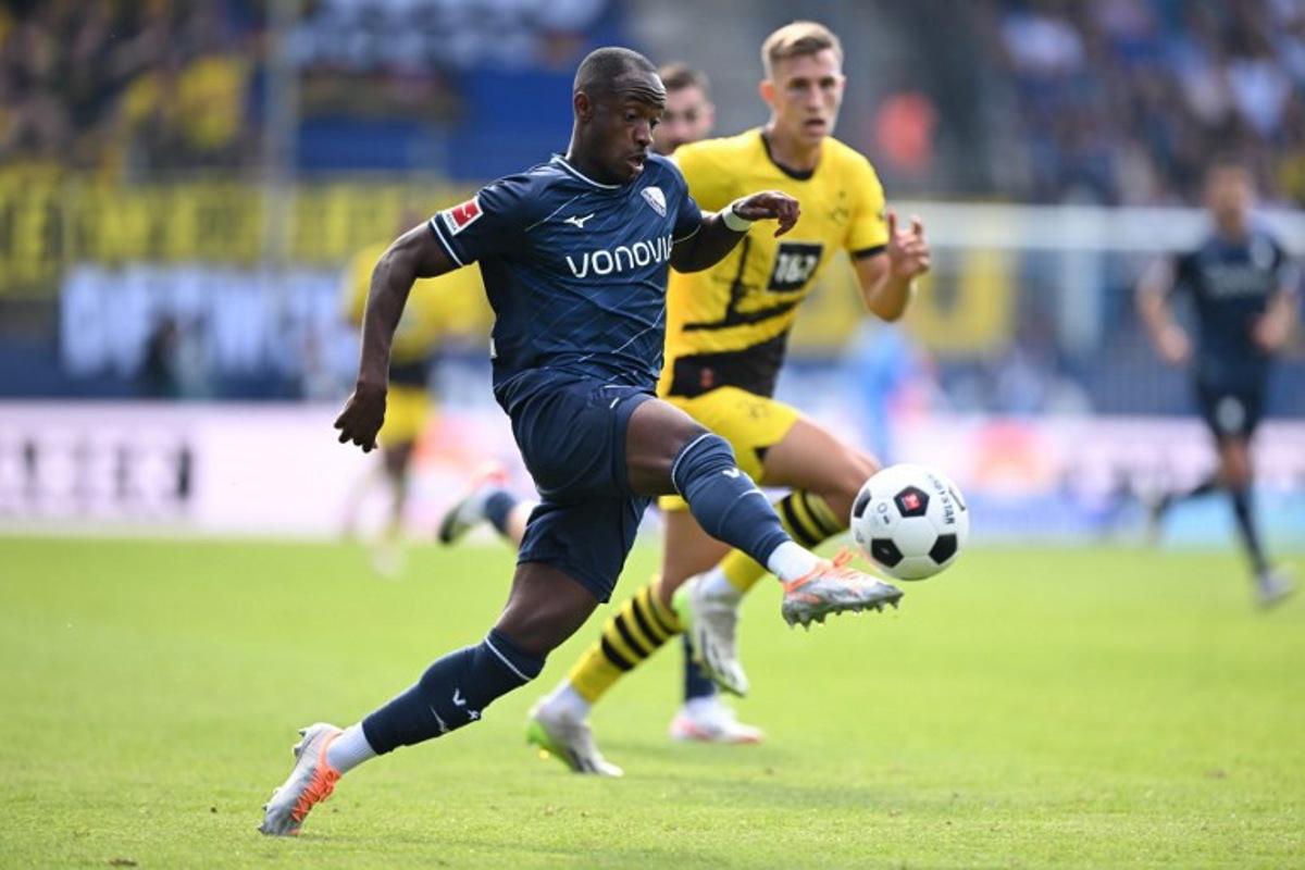 Bochum's Ghanaian forward #22 Christopher Antwi-Adjei (L) and Dortmund's German defender #04 Nico Schlotterbeck vie for the ball during the German first division Bundesliga football match between VfL Bochum and BVB Borussia Dortmund in Bochum, western Germany on August 26, 2023. INA FASSBENDER / AFP