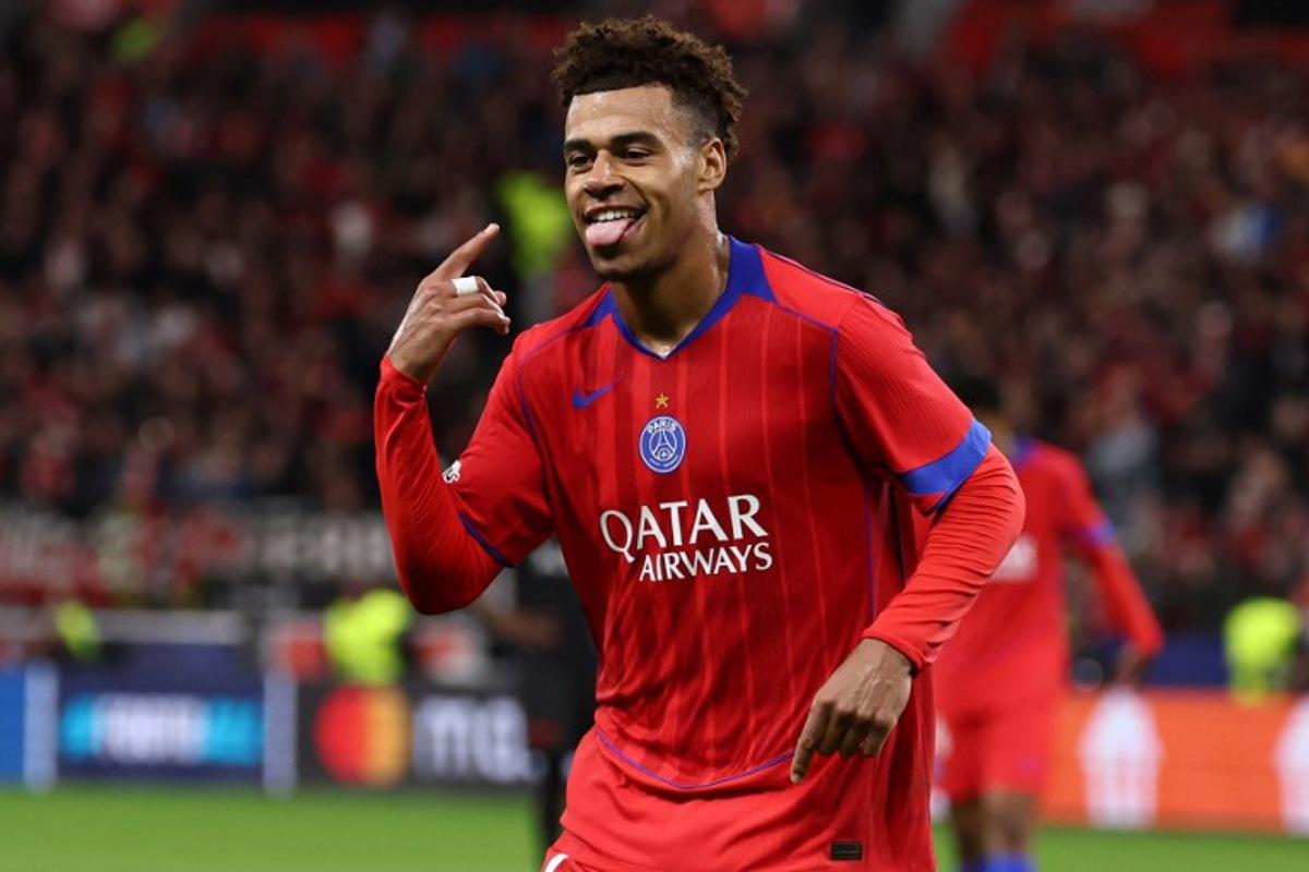 Paris Saint-Germain's French midfielder #14 Desire Doue celebrates scoring the 1-4 goal during the UEFA Champions League football match between Bayer 04 Leverkusen and Paris Saint-Germain (PSG) at the BayArena stadium in Leverkusen, western Germany on October 21, 2025. FRANCK FIFE / AFP