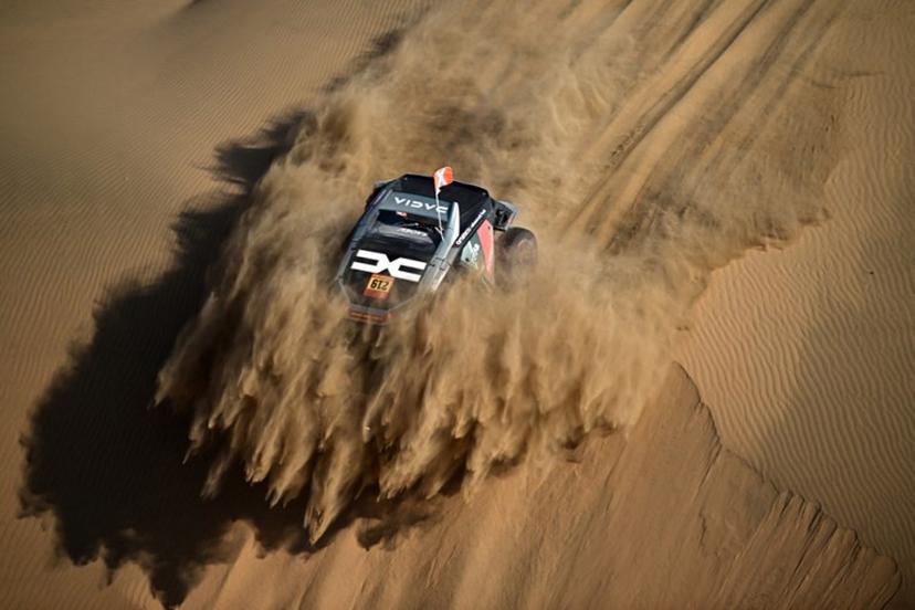 The Dacia Sandriders's French driver Sebastien Loeb and French co-pilot Edouard Boulanger compete in Stage 10 of the 48th edition of the Dakar Rally 2026, between Bisha and Bisha, Saudi Arabia, on January 14, 2026. Giuseppe CACACE / AFP