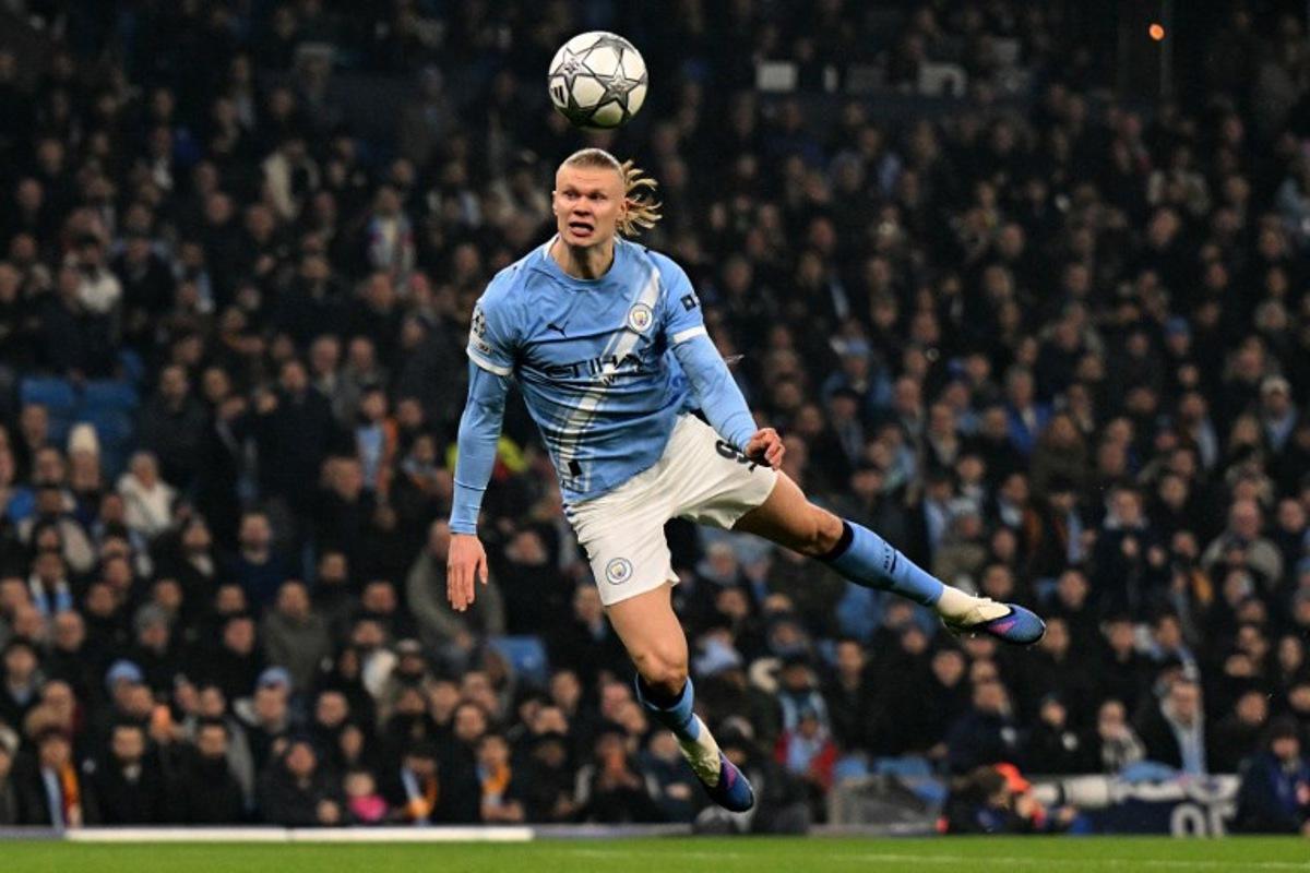Manchester City's Norwegian striker #09 Erling Haaland dives to header the ball at goal in the opening seconds of the match, but the shot goes wide during the UEFA Champions League football match between Manchester City and Galatasaray at the Etihad Stadium in Manchester, north west England, on January 28, 2026. Oli SCARFF / AFP