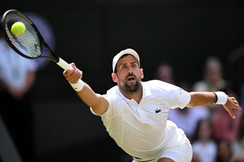 Serbia's Novak Djokovic returns to Russia's Roman Safiullin during their men's singles round of 16 tennis match on the seventh day of the 2026 Wimbledon Championships at The All England Lawn Tennis and Croquet Club in Wimbledon, southwest London, on July 5, 2026. Kirill KUDRYAVTSEV / AFP