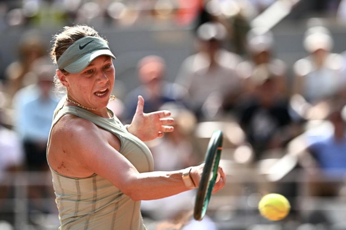 US Amanda Anisimova plays a forehand return to France's Diane Parry during their women's singles match on day 7 of the French Open tennis tournament on Court Philippe-Chatrier at the Roland-Garros Complex in Paris on May 30, 2026. JULIEN DE ROSA / AFP