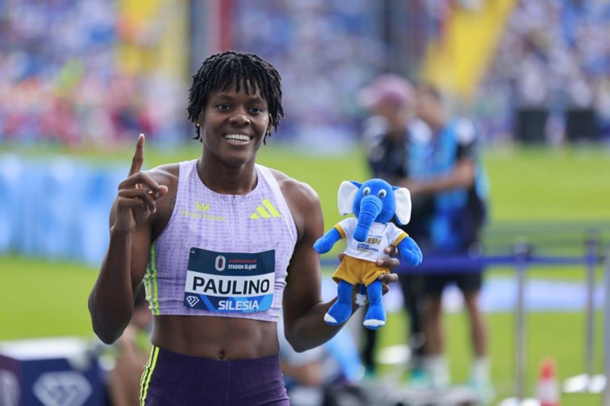 Winner Dominican Republic's Marileidy Paulino celebrates after the women's 400m event of the Silesia Diamond League athletics meeting in Katowice, Poland, on August 23, 2026. Wojtek RADWANSKI / AFP