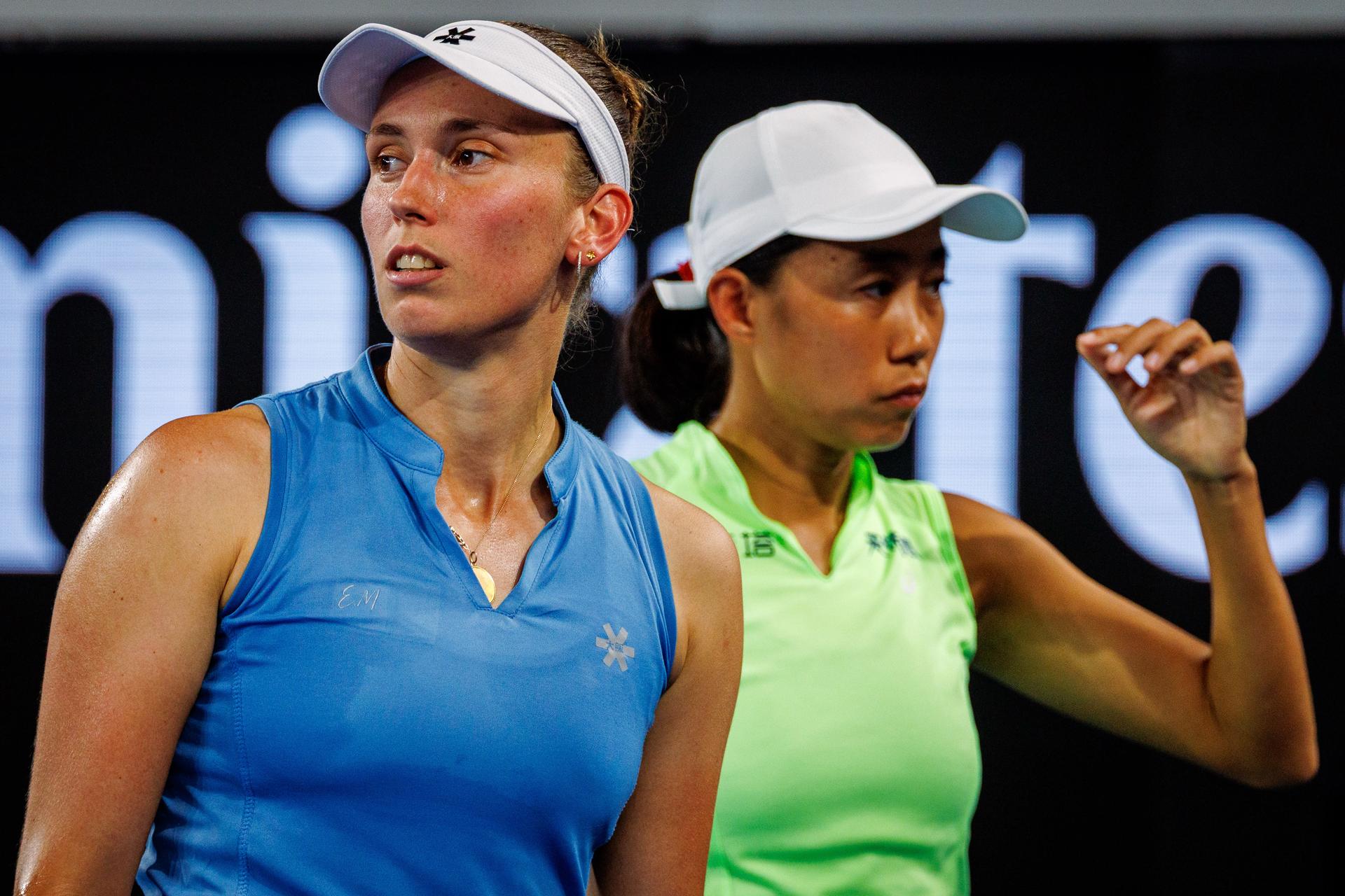 Belgium's Elise Mertens (blue) and Chinese Shuai Zhang (yellow) pictured during a tennis match between US pair Baptiste/Stearns and Belgian/ Chinese pair Mertens/Zhang, in the 1/8 final of the women doubles at the Australian Open, in Melbourne Park, Melbourne on Tuesday 27 January 2026. BELGA PHOTO PATRICK HAMILTON --- BENELUX ONLY ---