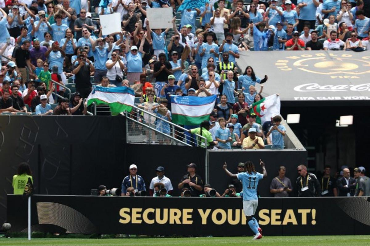 Manchester City's Belgian midfielder #11 Jeremy Doku celebrates scoring his team's second goal during the FIFA Club World Cup 2025 Group G football match between England's Manchester City and Morocco's Wydad AC at the Lincoln Financial Field stadium in Philadelphia on June 18, 2025. FRANCK FIFE / AFP
