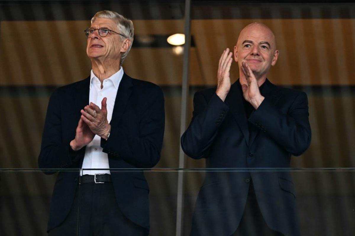 Former Arsenal's French manager Arsene Wenger (L) and FIFA President Gianni Infantino applaud ahead of the UEFA Women's Euro 2025 quarter-final football match between Sweden and England at Letzigrund Stadium in Zurich, on July 17, 2025. Fabrice COFFRINI / AFP