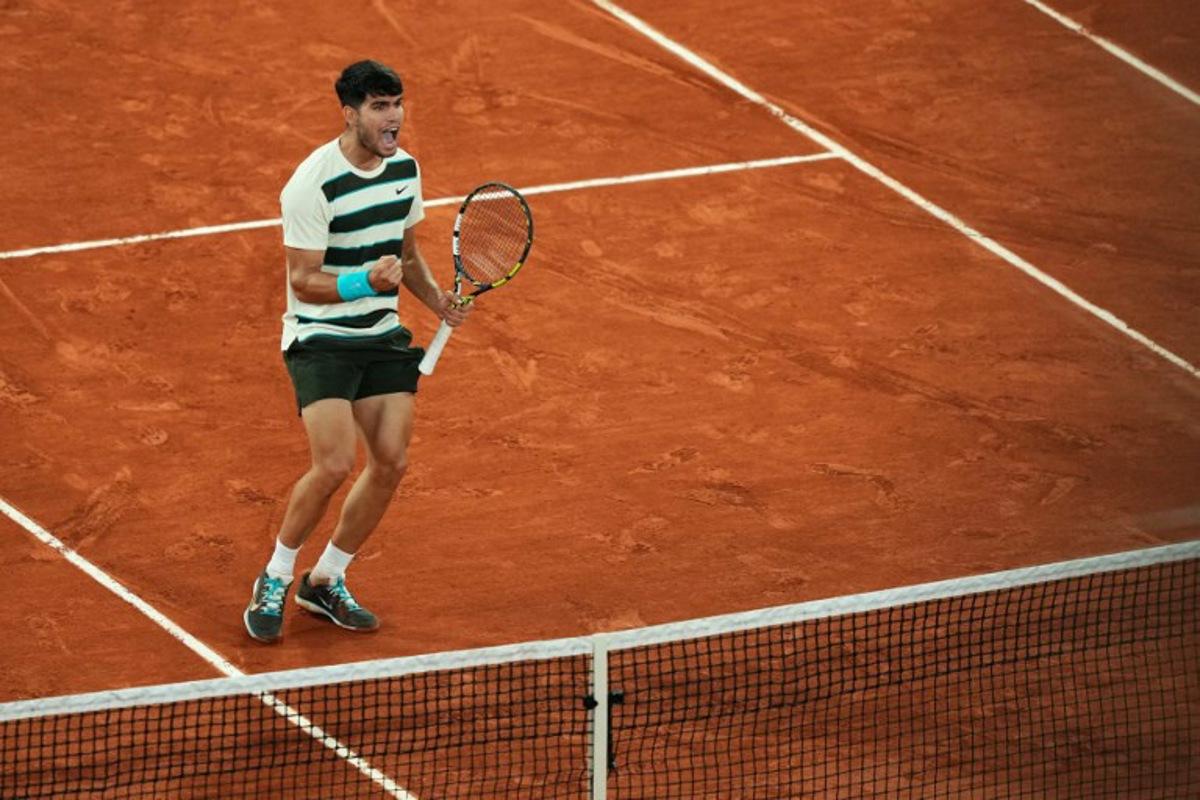 Spain's Carlos Alcaraz reacts to a point against as he plays against Italy's Lorenzo Musetti during their men's singles semi-final match on day 13 of the French Open tennis tournament on Court Philippe-Chatrier at the Roland-Garros Complex in Paris on June 6, 2025. Dimitar DILKOFF / AFP