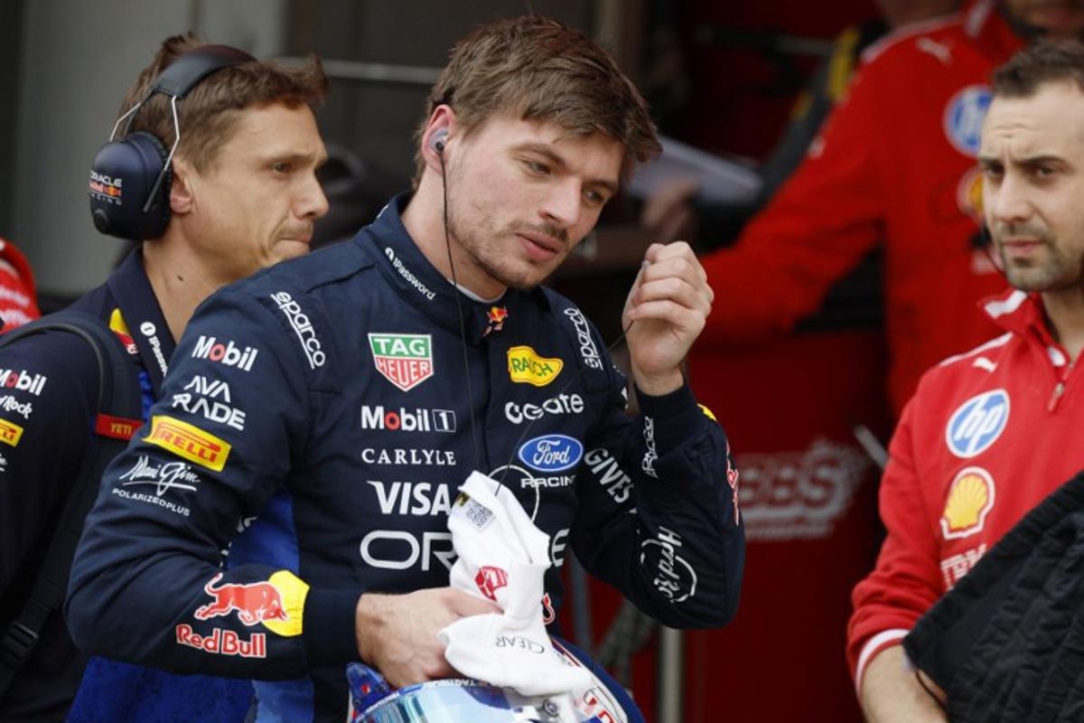 Red Bull Racing's Dutch driver Max Verstappen takes off his earpiece in the pits during the qualifying session ahead of the Formula One Japanese Grand Prix at the Suzuka circuit in Suzuka, Mie prefecture on March 28, 2026. FRANCK ROBICHON / POOL / AFP